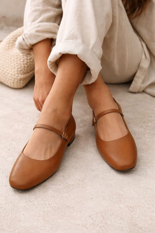 Tan Mary Jane–style flats